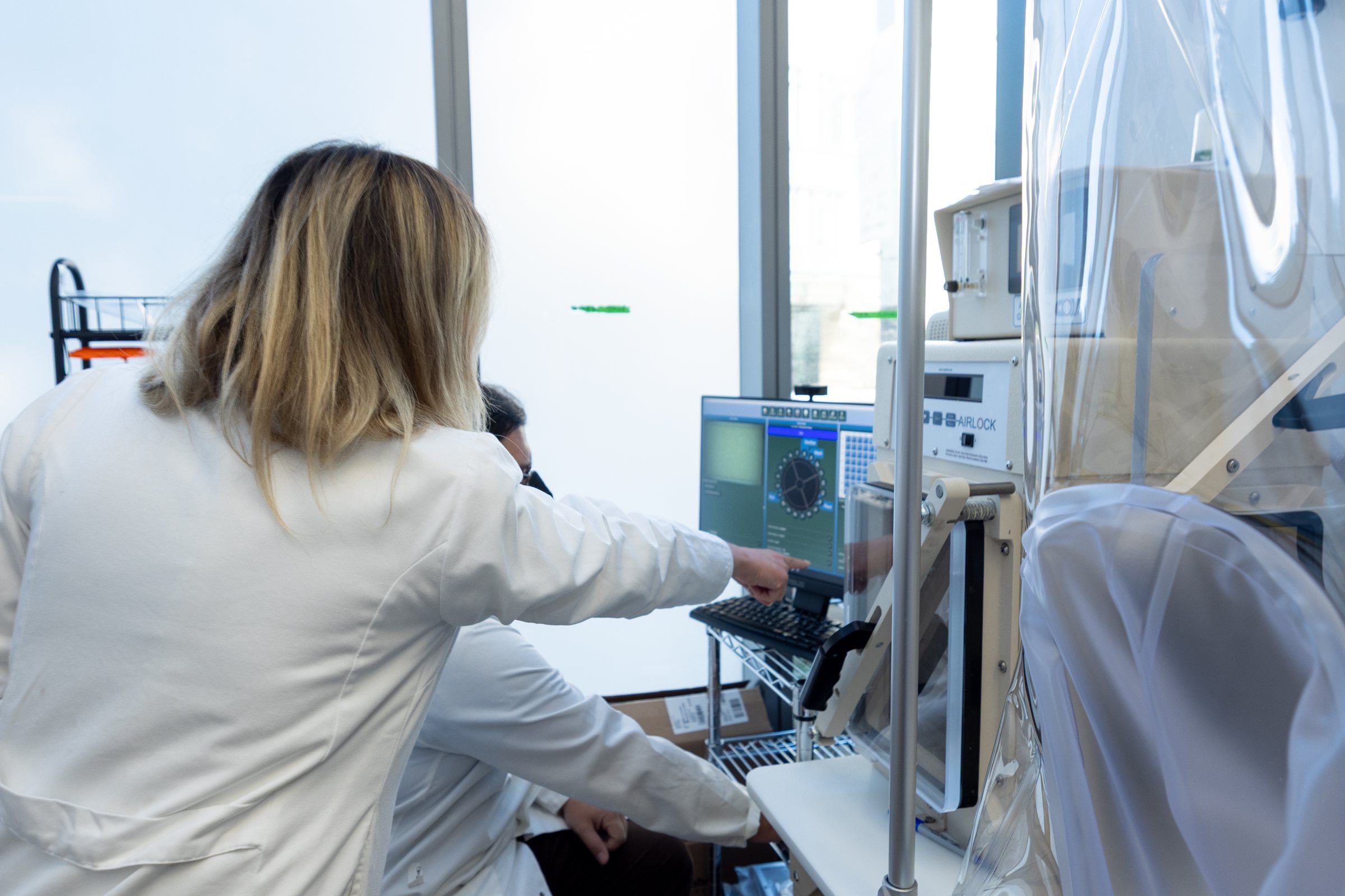 A lab member at a chamber workstation